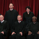 The Supreme Court Justices in 2017, before Justice Anthony Kennedy retired. Thomas is seated in the front row, second from the right.